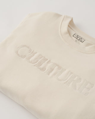 Beige sweatshirt with 'Quasture' branding on a light gray background